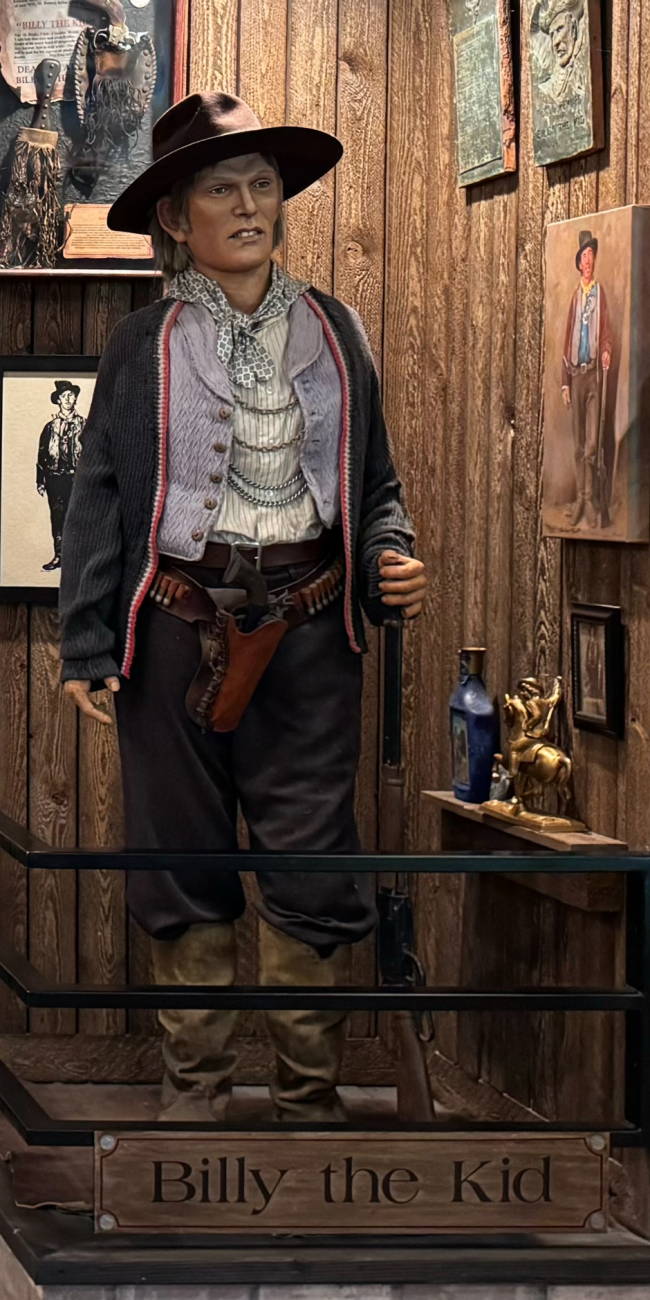 Wax figure of a cowboy in museum.