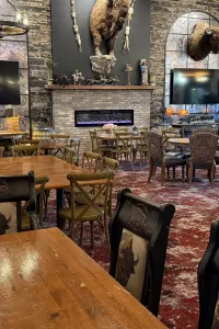 Rustic restaurant interior with buffalo decor.