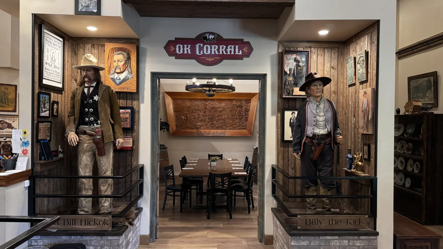 Wild West-themed restaurant entrance with statues.