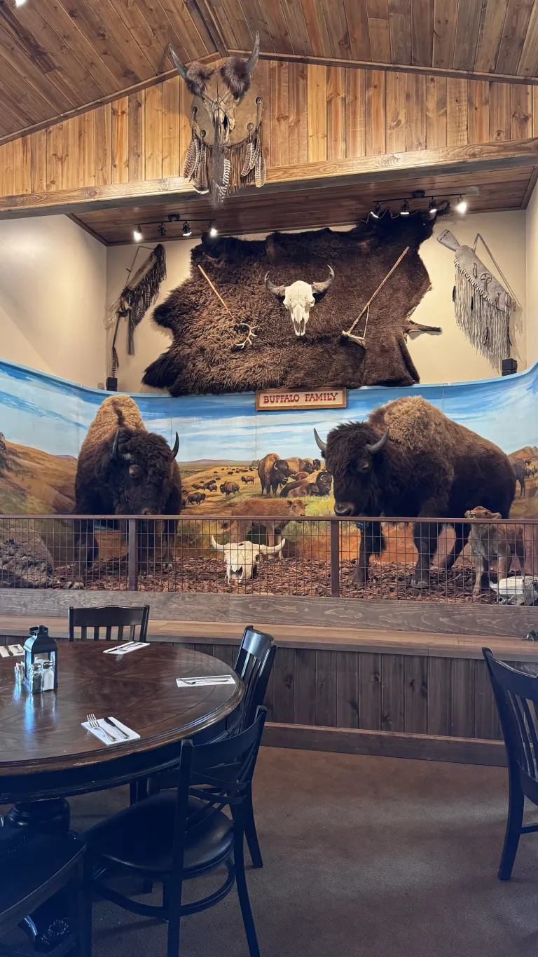 Bison-themed restaurant interior with rustic decor.
