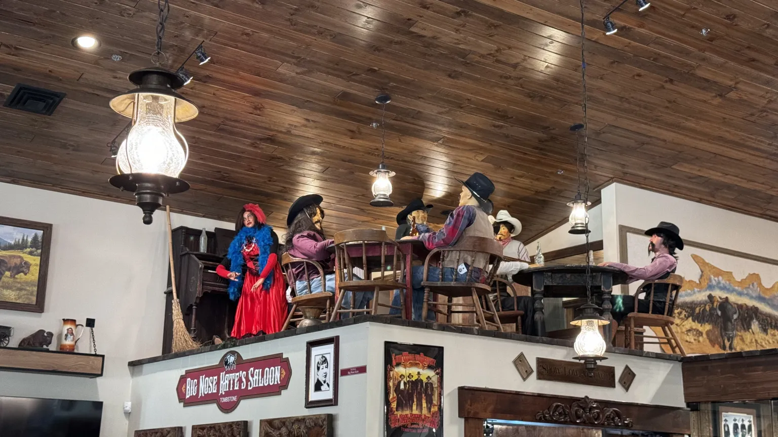 Western-themed figures in saloon setting display.